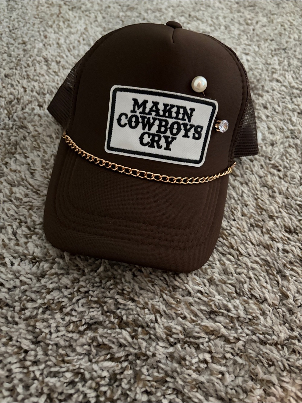 Makin Cowboys Cry Brown Trucker Hat with Gold Chain